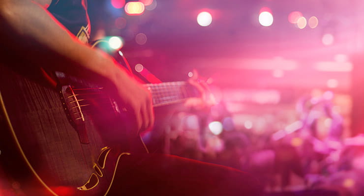 Man Playing on Electric Guitar