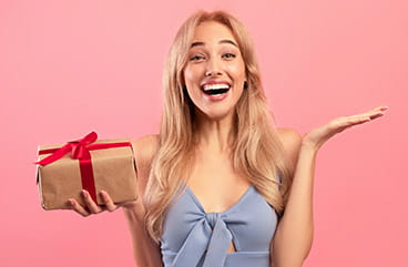 Happy Woman Holding a Gift Box