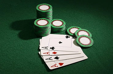A Pack of Cards and Chips on a Casino Table