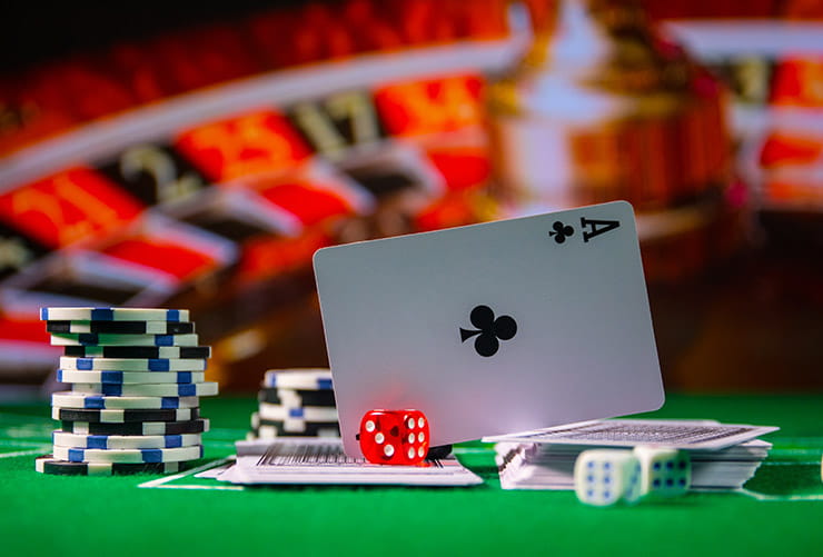 Ace Card and a Red Dice on a Casino Table