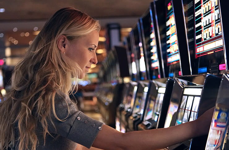 Woman Playing on Slot Machines at Kewadin Casino