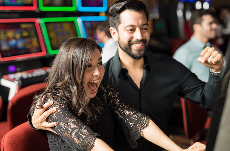Man and Woman Enjoying Gambling at Kewadin Casino